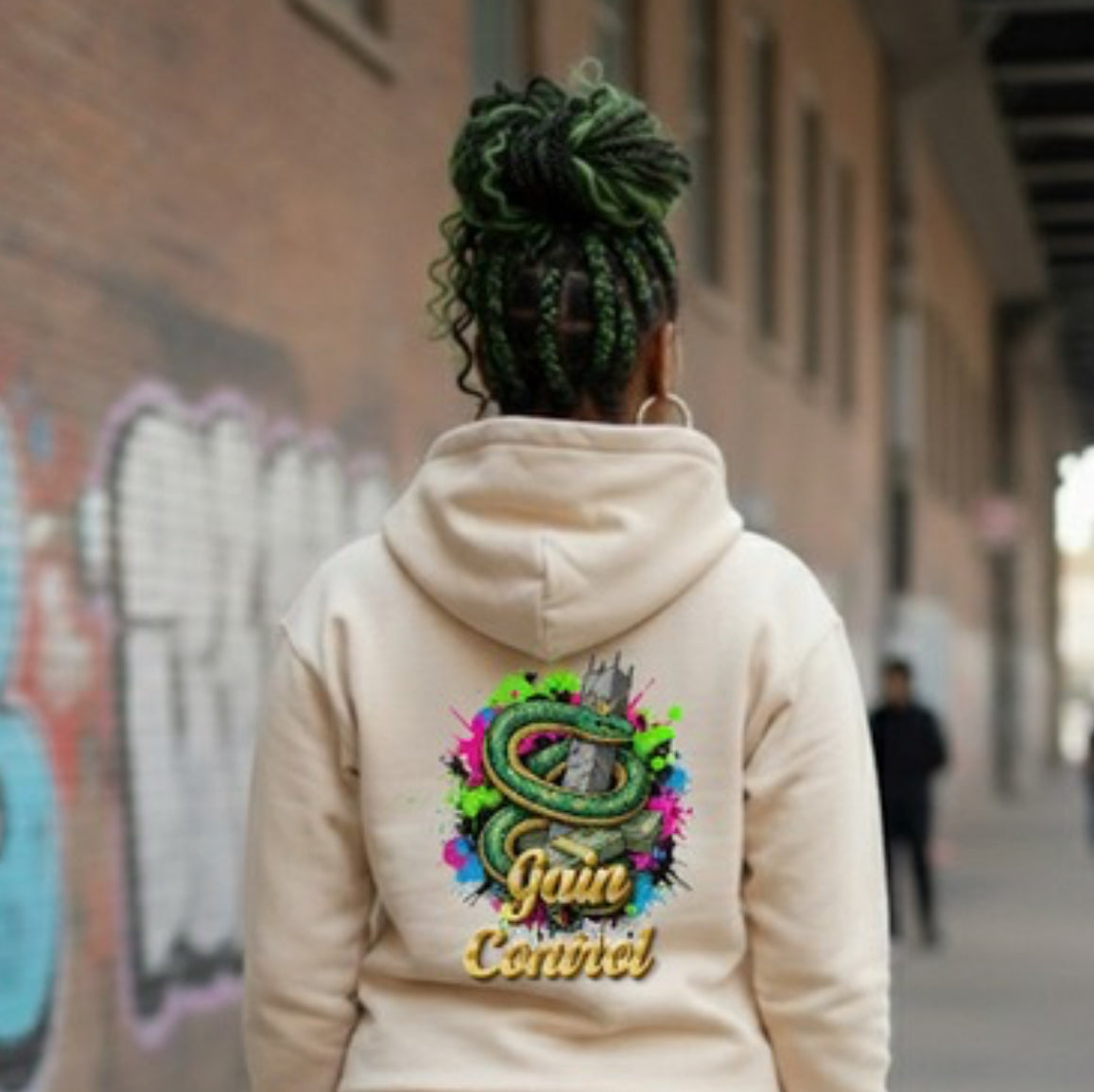 Gain Control- HOODIE featuring vibrant snake design on back, worn casually outdoors.