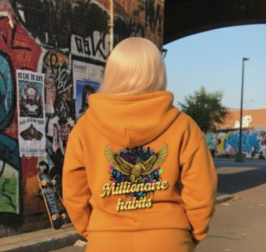 Millionaire Habits- HOODIE displayed on a model in an urban streetwear setting.