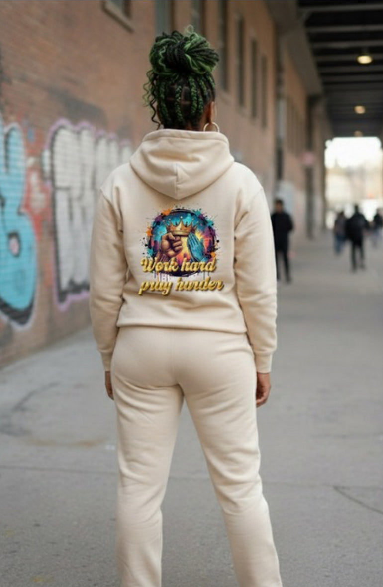 Work Hard- HOODIE showcased on a person in a street setting with a colorful design, embodying streetwear style.
