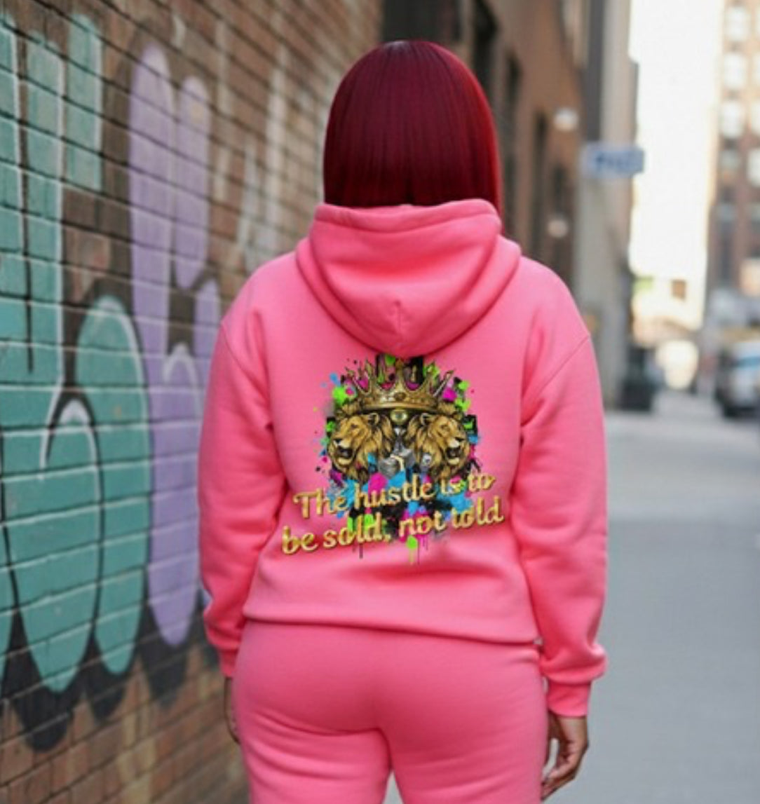The Hustle Should Be Sold- HOODIE displayed on a model in a pink Crown Hustle Fleece Pullover streetwear outfit.