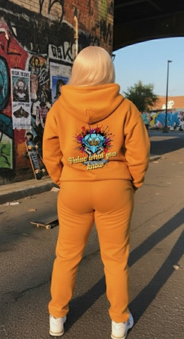 Value What You Know ￼- HOODIE worn by a person in an urban setting, showcasing the streetwear style and vibrant design.