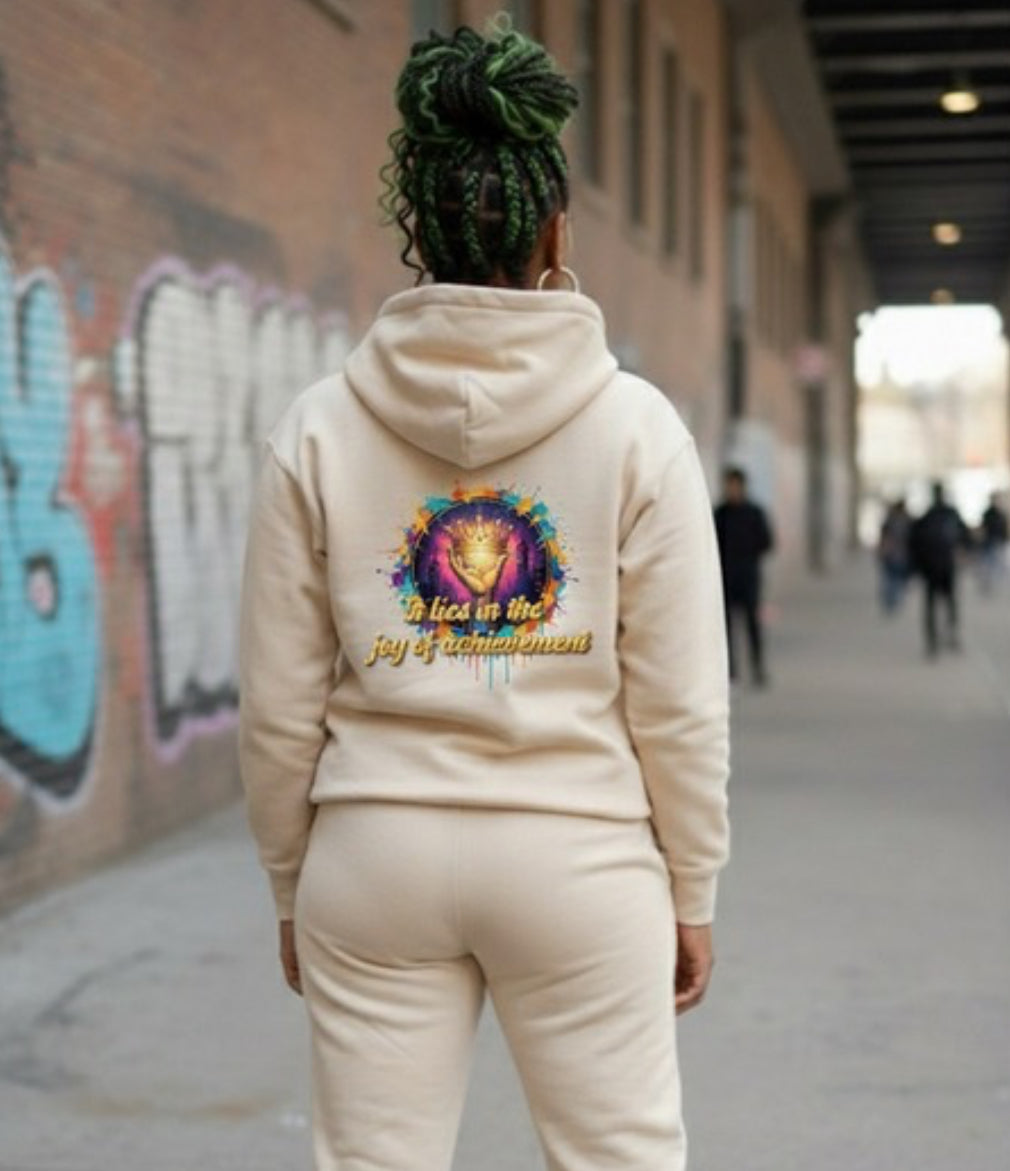Joy of Achievement- HOODIE showcased in an urban setting, featuring vibrant artwork on the back.