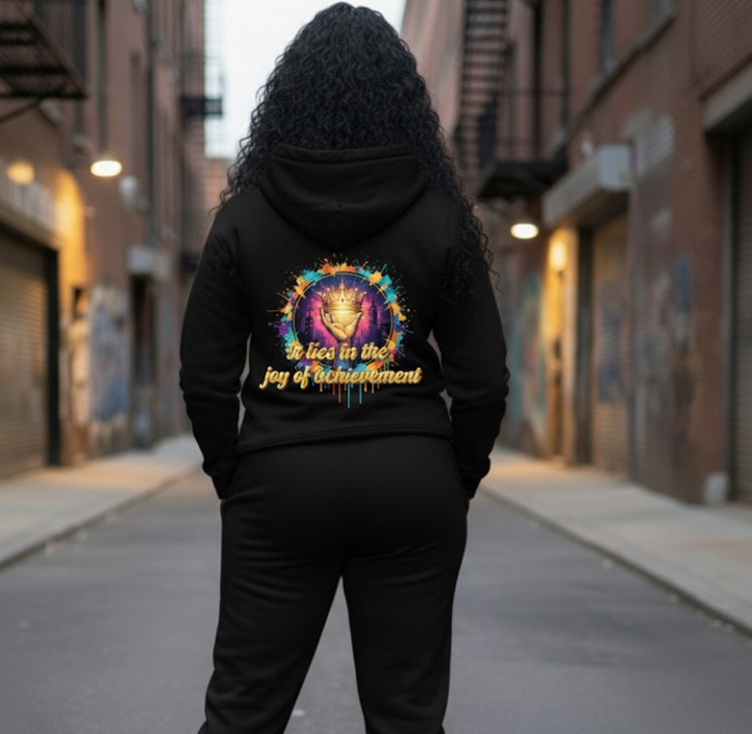 Joy of Achievement- HOODIE displayed on a model in a streetwear setting, showcasing vibrant back design.