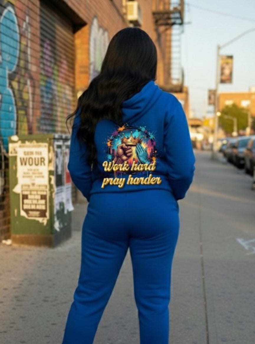 Invest In Knowledge- HOODIE: Woman wearing blue hoodie with 'Work hard pray harder' graphic on urban street.