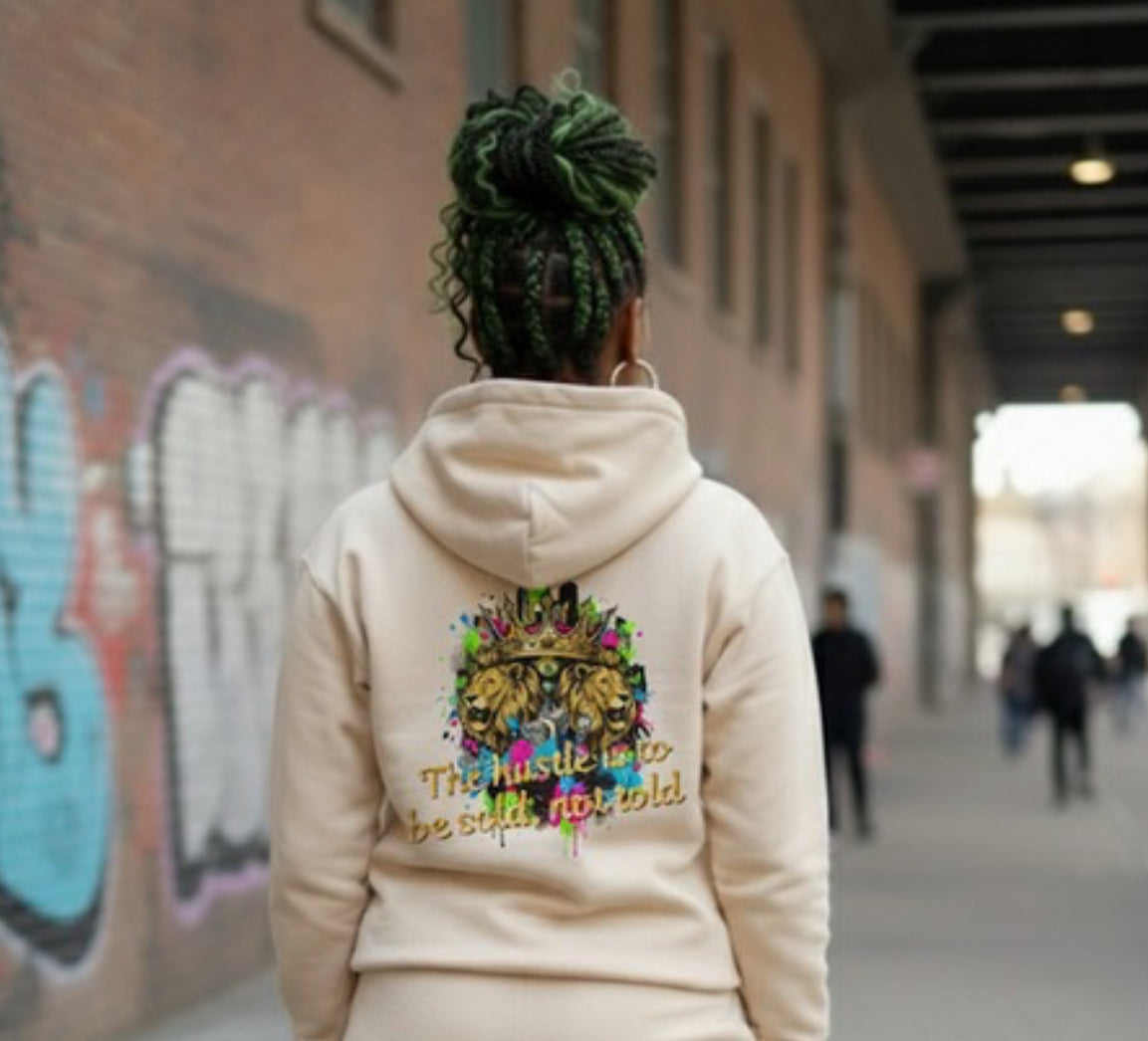 The Hustle Should Be Sold- HOODIE displayed on a person in a streetwear setting, showcasing its vibrant design.