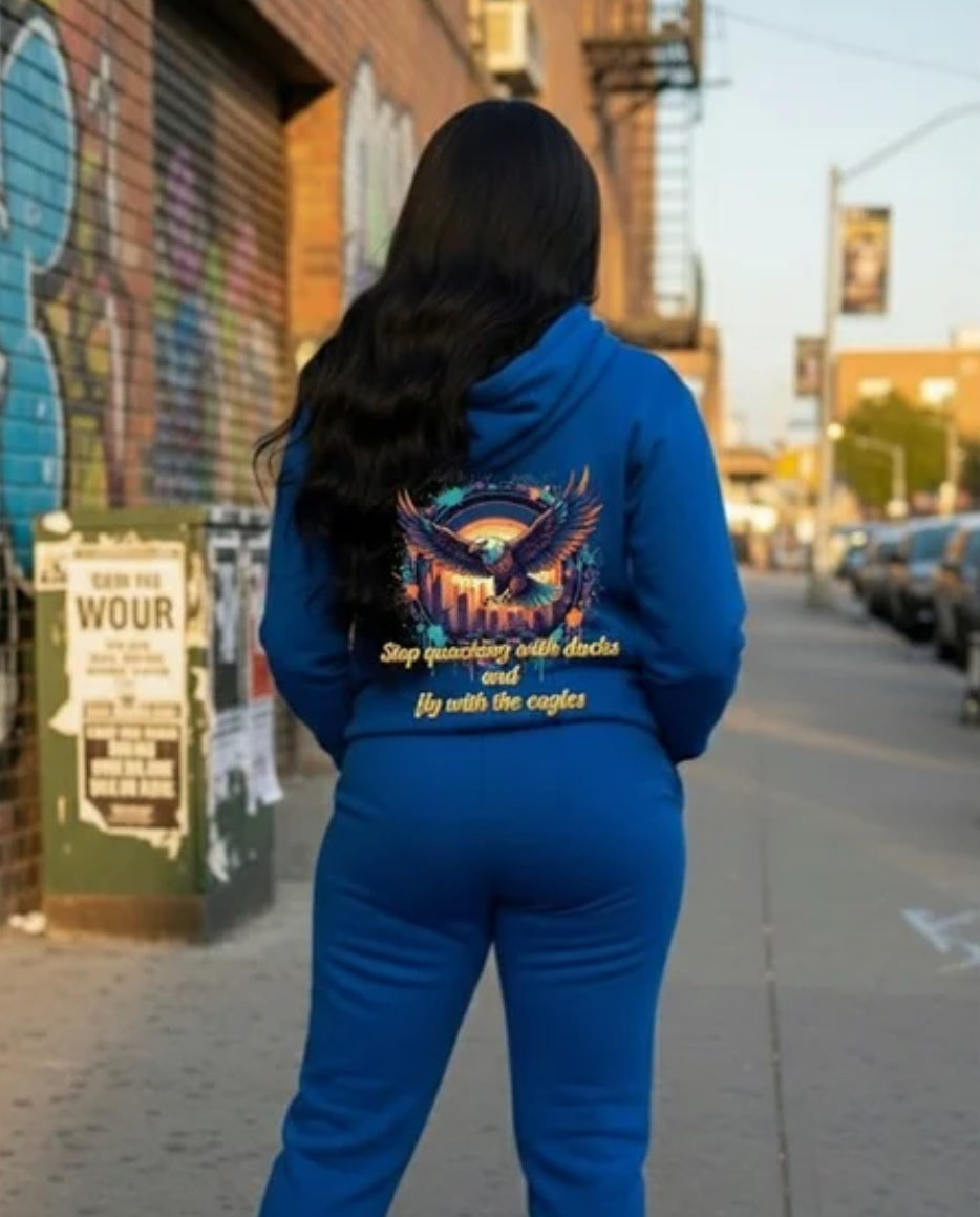Fly With The Eagles- HOODIE on model in urban setting showcasing bold graphic design.