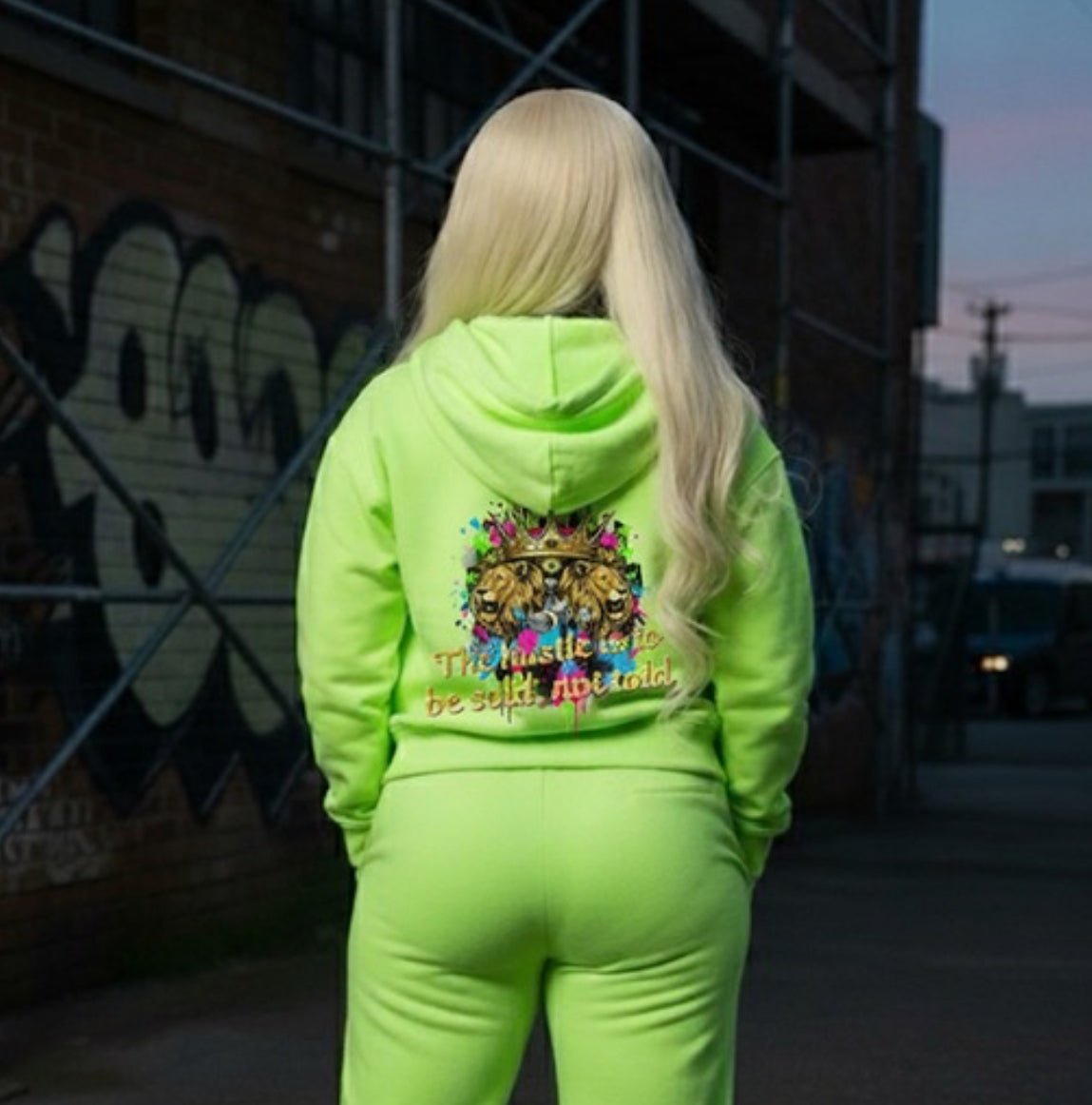 The Hustle Should Be Sold- HOODIE in neon green, showcasing a vibrant streetwear design on the back.
