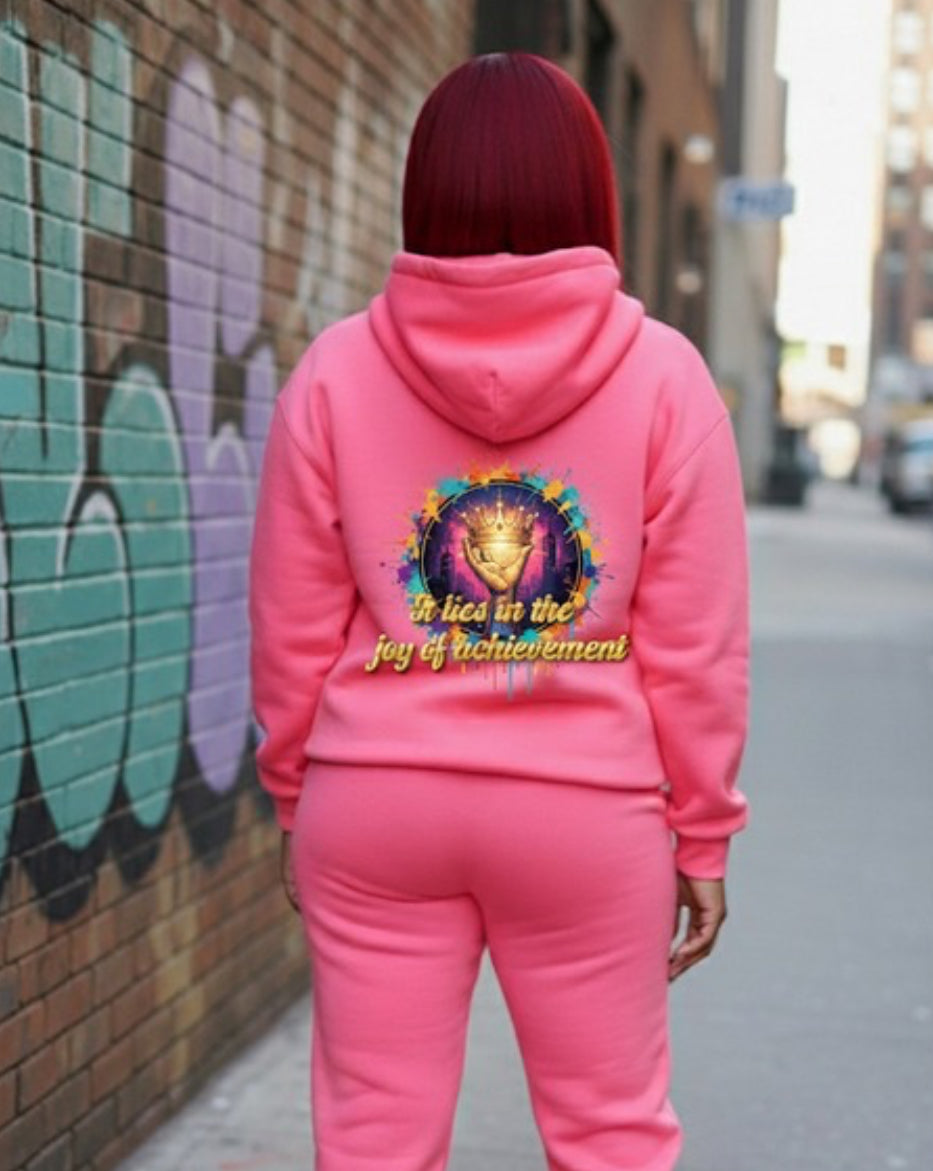 Joy of Achievement- HOODIE displayed on a model wearing a pink Crown Hustle Fleece Pullover Streetwear outfit.