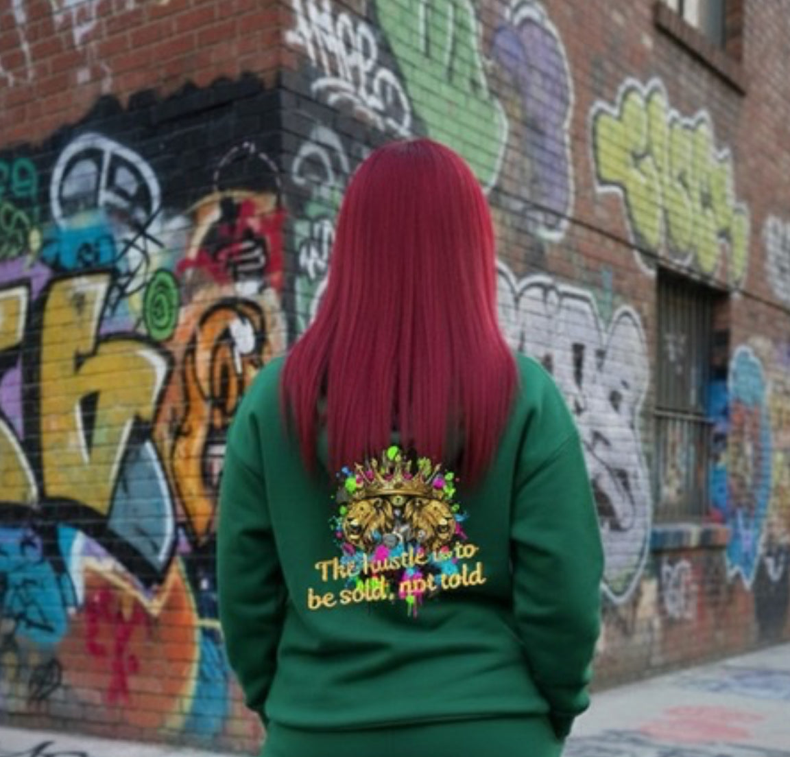 The Hustle Should Be Sold- HOODIE shown on model in front of graffiti wall, featuring colorful design.