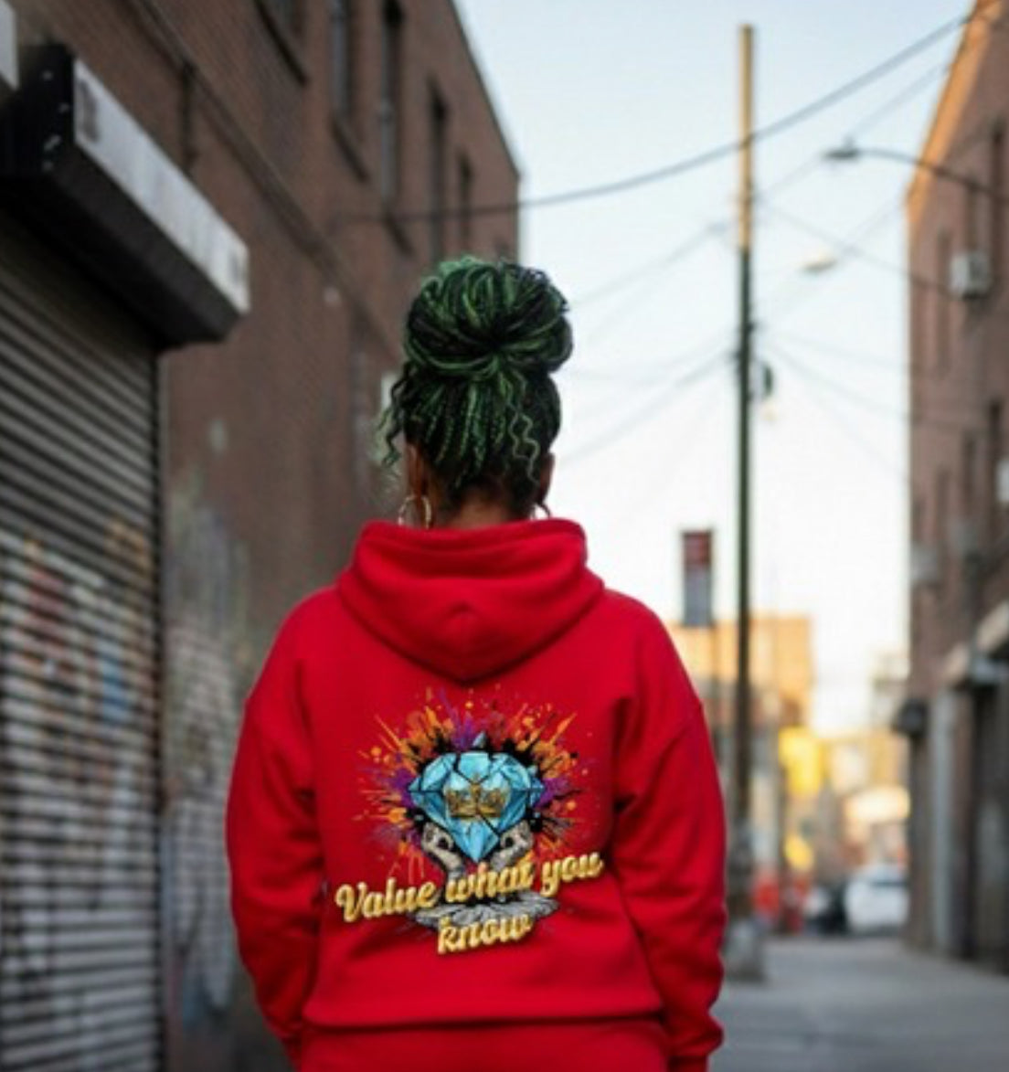 Value What You Know ￼- HOODIE displayed on a person walking in the street, showcasing Crown Hustle Fleece Pullover Streetwear.