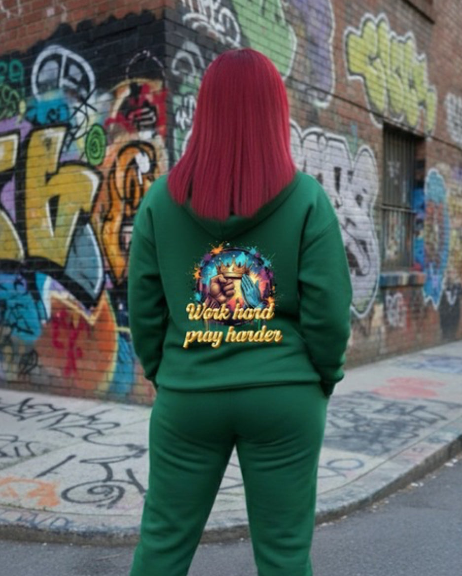 Work Hard- HOODIE showcased on a model in a vibrant urban setting, emphasizing streetwear style and bold graphics.