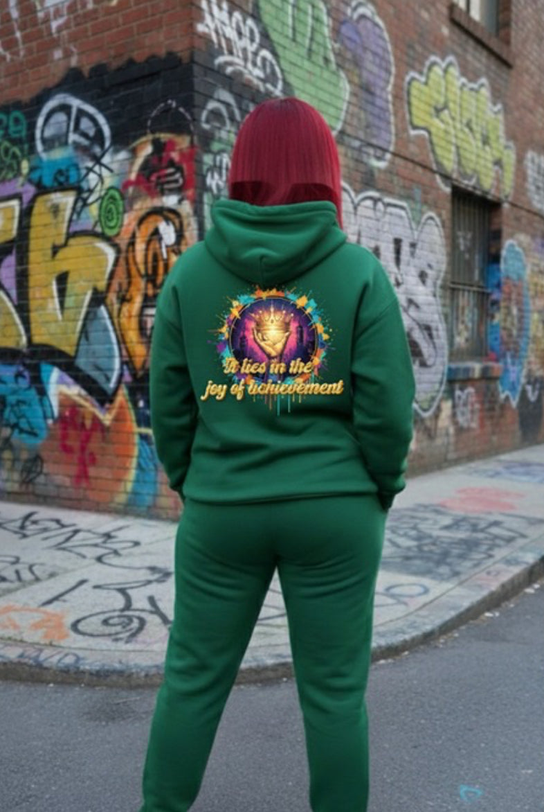 Joy of Achievement- HOODIE worn by person against colorful street graffiti background.